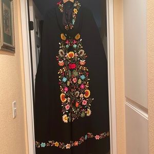 Wool cape made in Ecuador.  Length is 54 inches , fully lined  with slit pockets